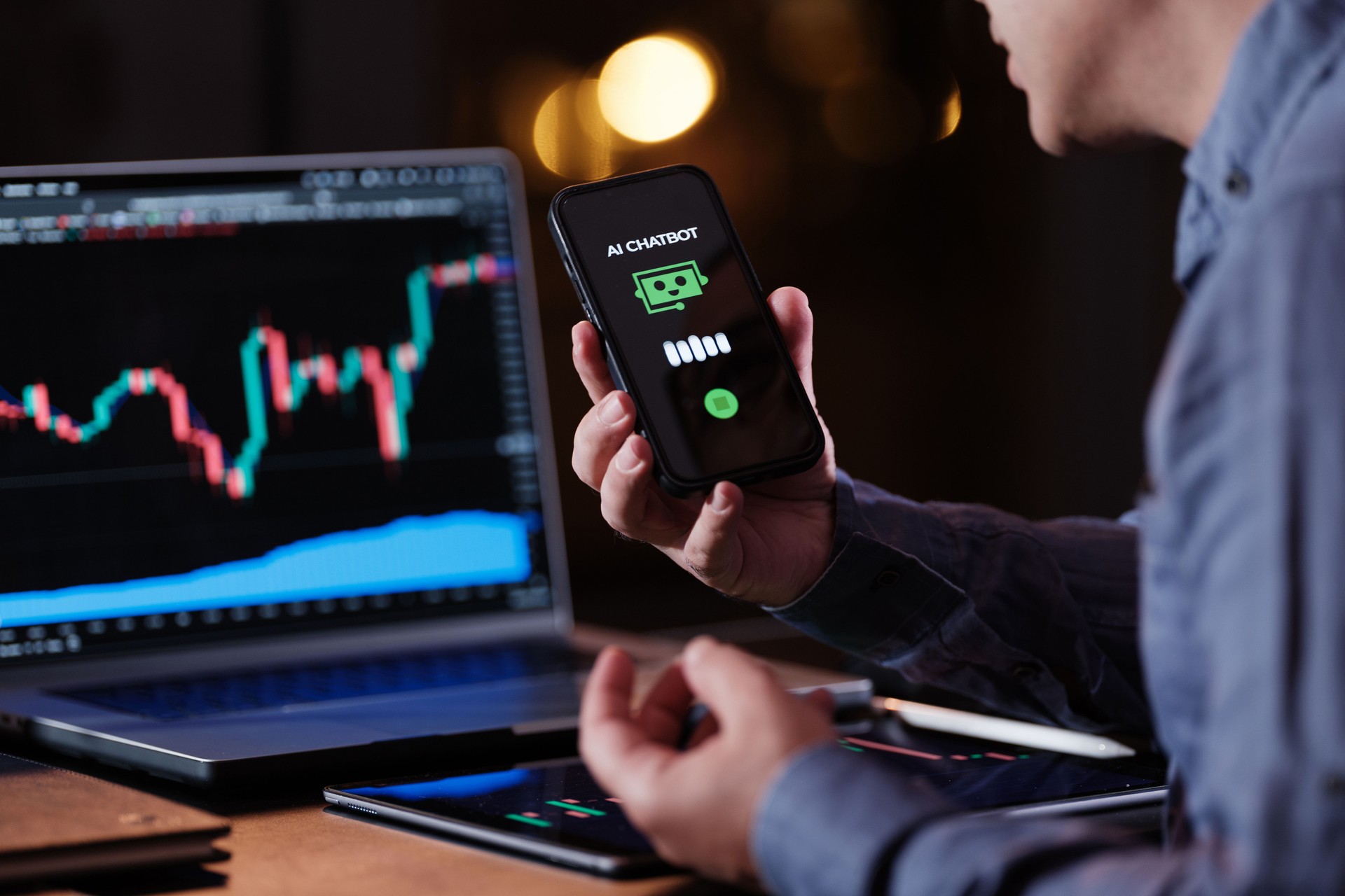 Man using AI Chatbot while checking his stock market exchange investment using TradingView on laptop computer